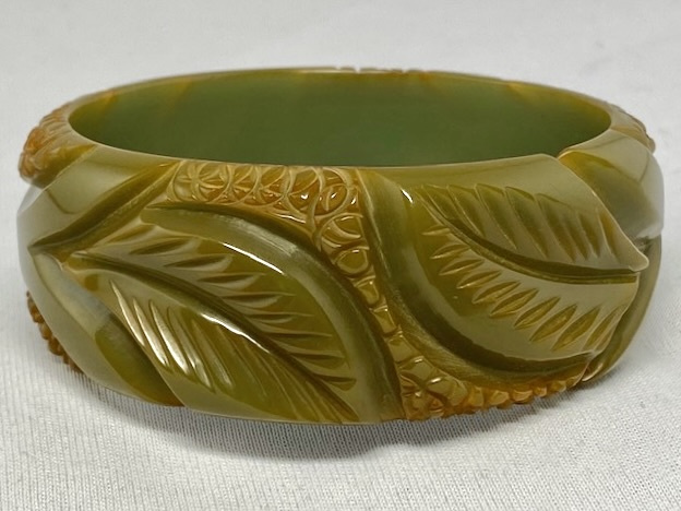 BB264 wide leaf & circle carved soft olive green bakelite bangle